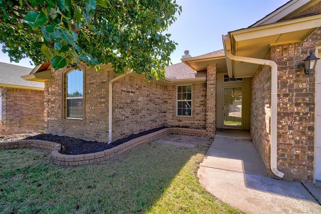 entrance to property with a yard