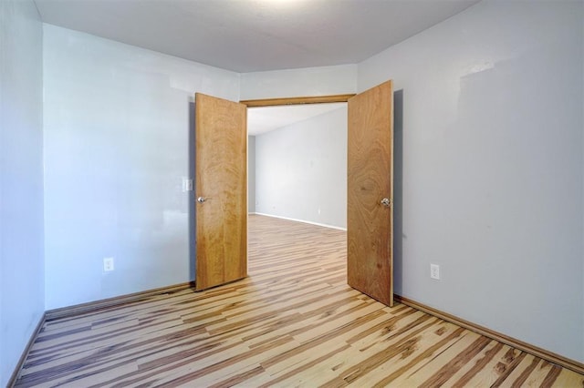 unfurnished room featuring light hardwood / wood-style flooring