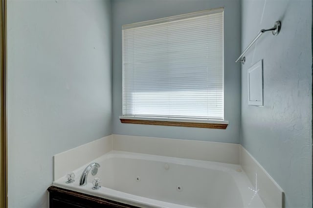 bathroom featuring a washtub