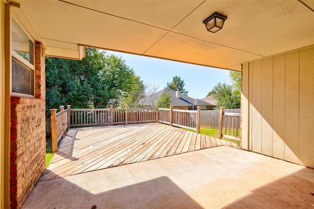 wooden terrace with a patio