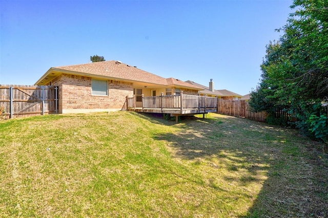 view of yard with a wooden deck