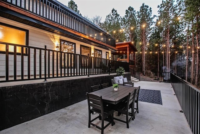 view of patio terrace at dusk