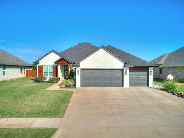 view of front of property featuring a garage and a front lawn