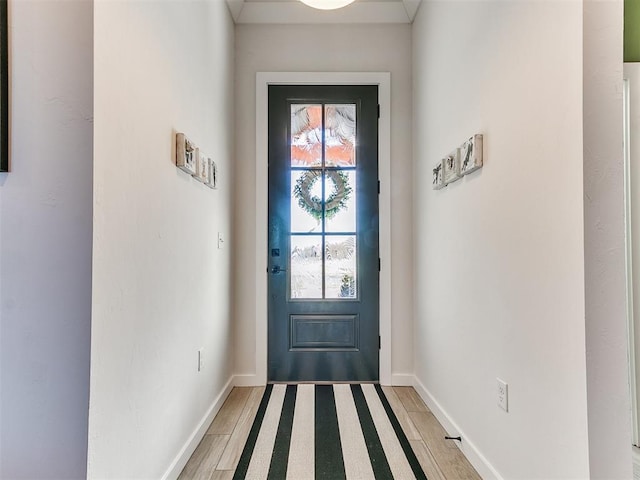 doorway with hardwood / wood-style floors