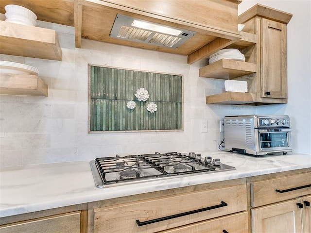 kitchen featuring stainless steel gas cooktop and light brown cabinets