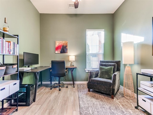 office with ceiling fan and light wood-type flooring