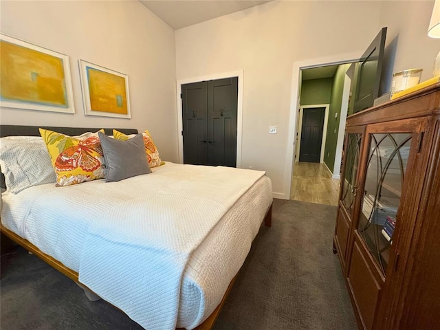 carpeted bedroom featuring a closet