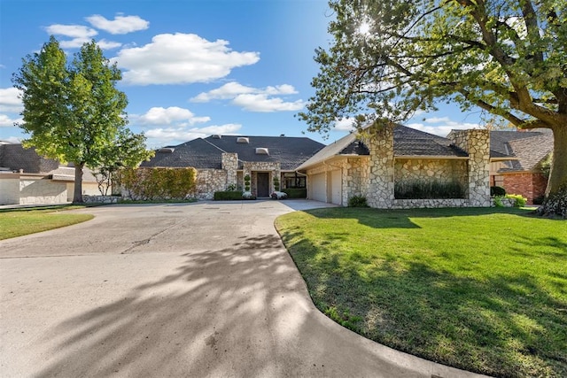 ranch-style house with a garage and a front lawn