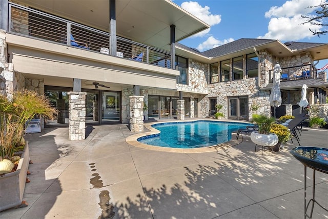 view of pool featuring ceiling fan and a patio