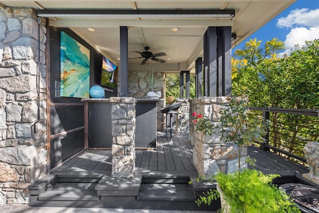 wooden deck with ceiling fan