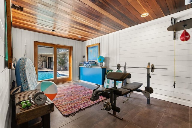 exercise area with wooden walls and wood ceiling