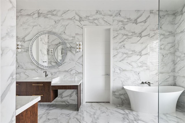 bathroom featuring a bathtub, tile walls, and vanity