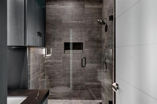 bathroom with vanity and an enclosed shower