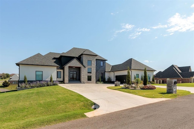 french country style house with a front yard and a garage