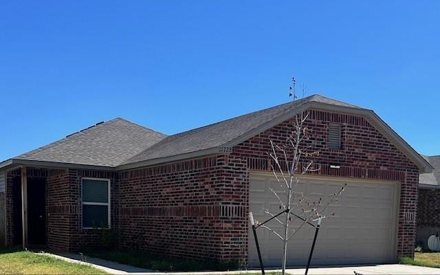 view of side of home with a garage