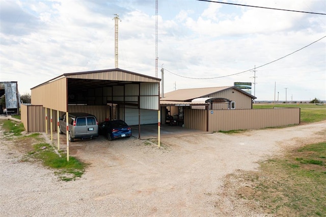 view of outbuilding featuring a carport