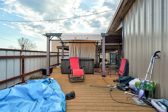 deck featuring a hot tub