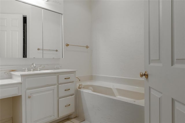 full bathroom with a garden tub and vanity