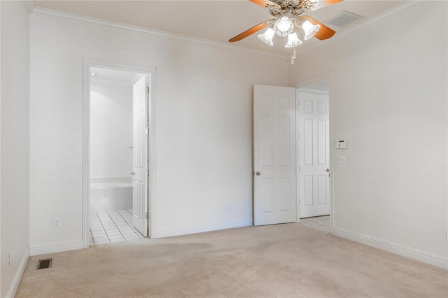 interior space featuring visible vents, ornamental molding, and light colored carpet