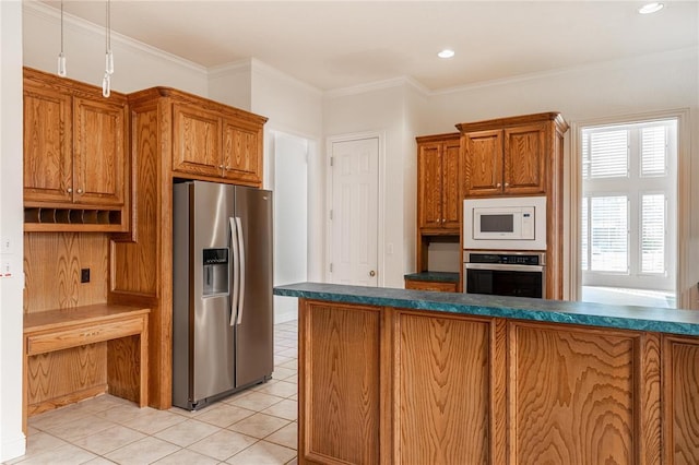 kitchen with light tile patterned floors, stainless steel appliances, dark countertops, brown cabinetry, and ornamental molding