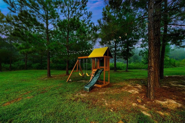 view of jungle gym featuring a lawn