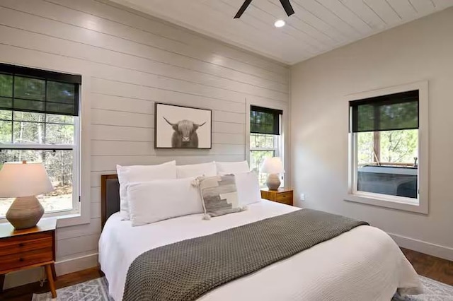 bedroom with hardwood / wood-style floors and ceiling fan