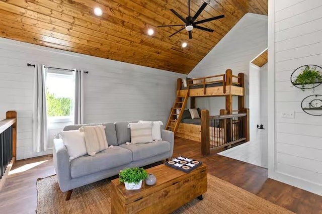 living room with wood ceiling, ceiling fan, wooden walls, dark hardwood / wood-style flooring, and vaulted ceiling