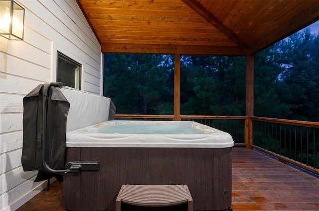 wooden terrace with a hot tub