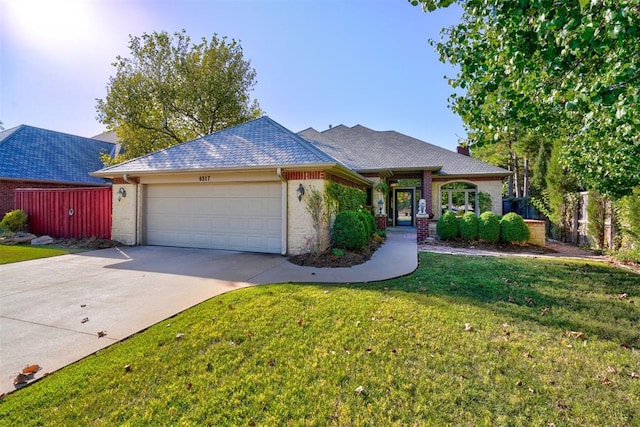 view of front facade with a front lawn and a garage