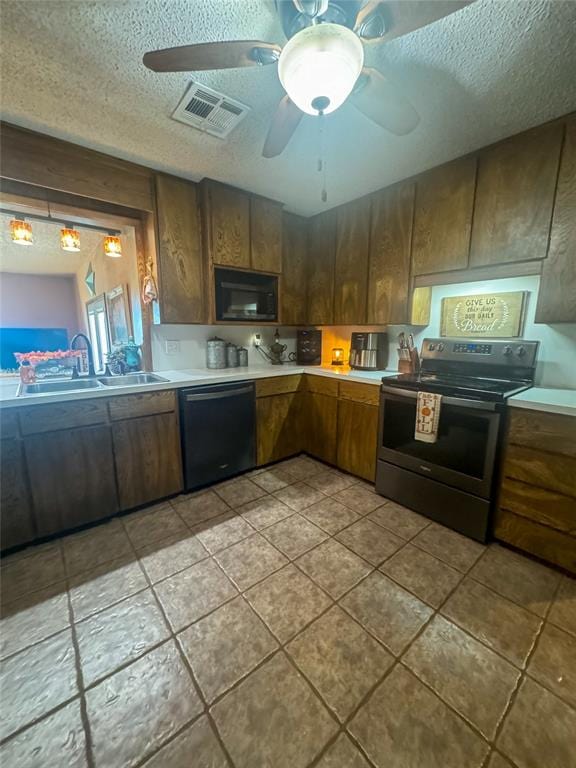 kitchen featuring ceiling fan, light tile patterned floors, black appliances, and a textured ceiling