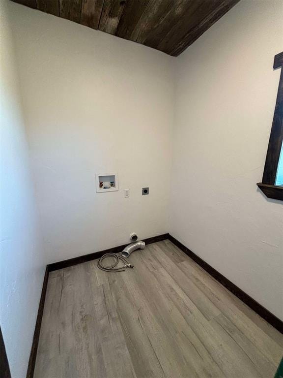 laundry area with hookup for a washing machine, light wood-type flooring, electric dryer hookup, and wood ceiling