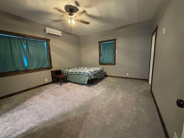 bedroom with carpet flooring, an AC wall unit, and ceiling fan