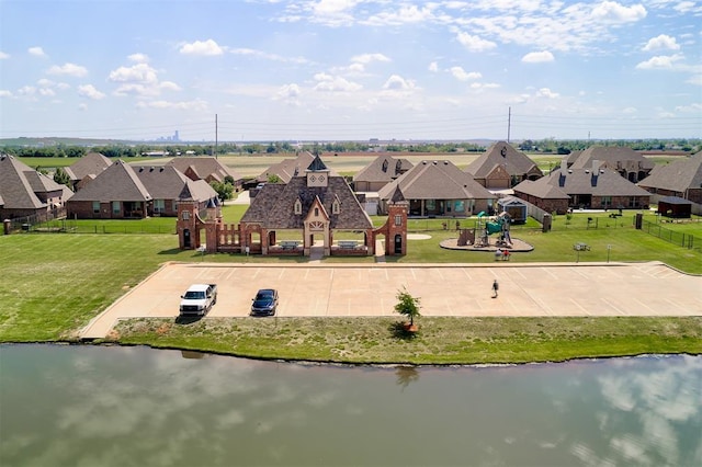 bird's eye view featuring a residential view and a water view