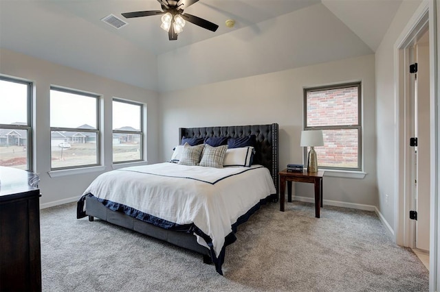 bedroom featuring visible vents, a ceiling fan, light carpet, vaulted ceiling, and baseboards