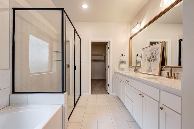 full bathroom featuring a sink, a shower stall, a bath, and double vanity