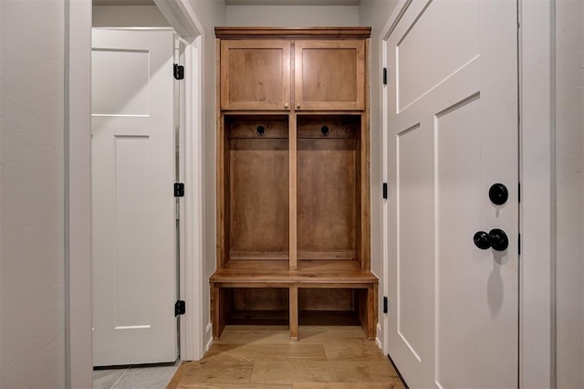 mudroom with light wood-style floors