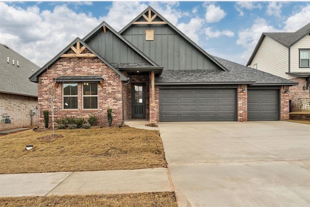 craftsman house with a garage, a shingled roof, concrete driveway, board and batten siding, and brick siding