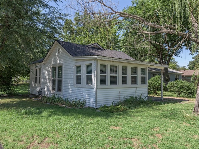 view of home's exterior featuring a yard