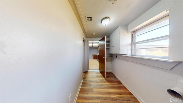 hallway featuring hardwood / wood-style flooring