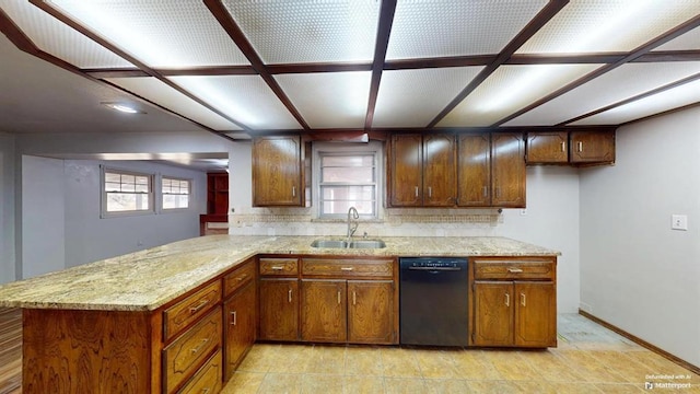 kitchen with kitchen peninsula, black dishwasher, sink, tasteful backsplash, and light stone counters