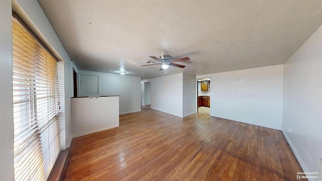 unfurnished room featuring hardwood / wood-style flooring and ceiling fan