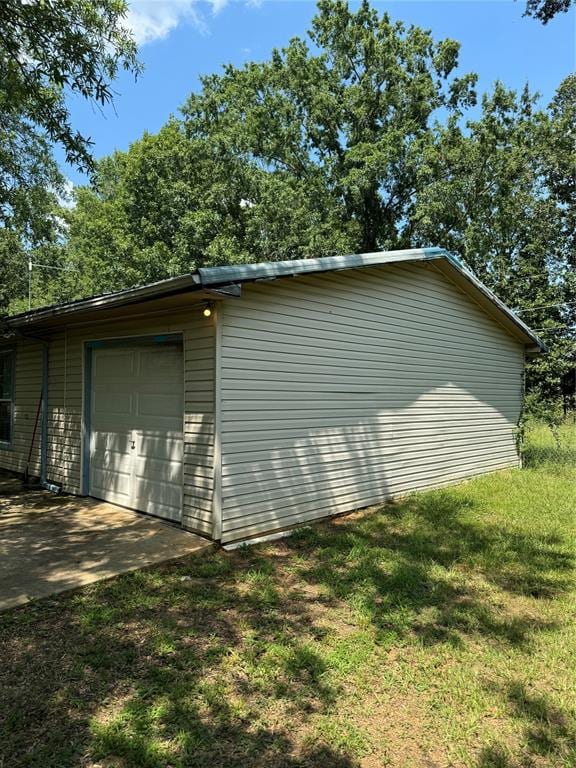 garage with a lawn