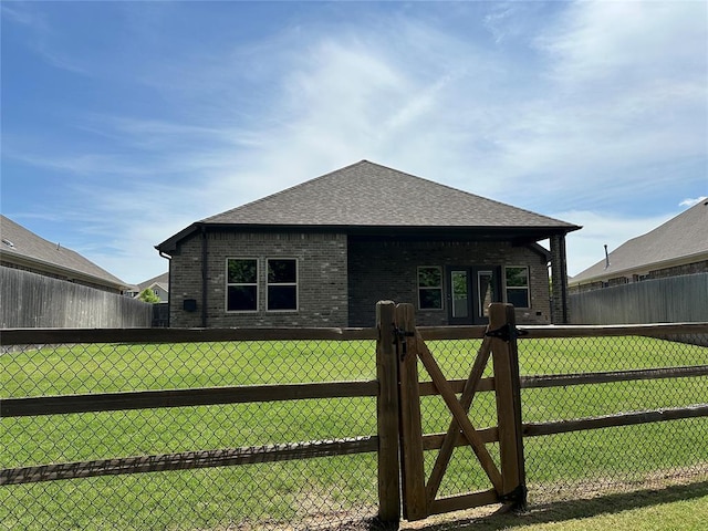 view of side of home with a lawn