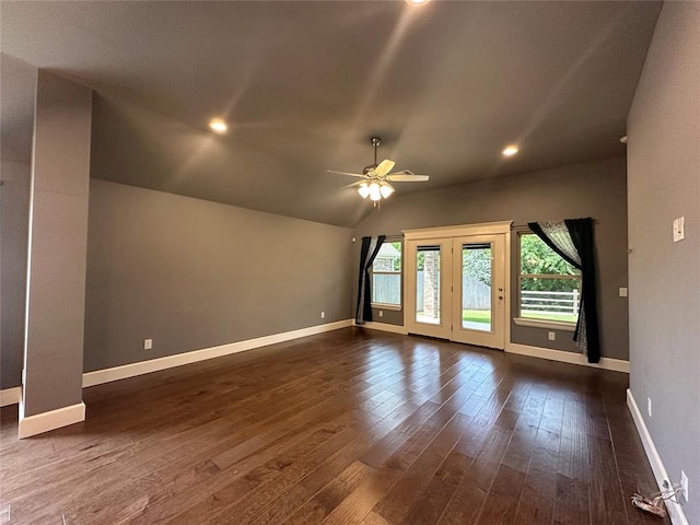 interior space with ceiling fan, dark wood-type flooring, and vaulted ceiling