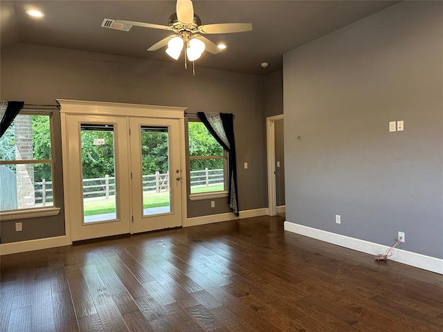 interior space featuring dark hardwood / wood-style floors, vaulted ceiling, plenty of natural light, and ceiling fan