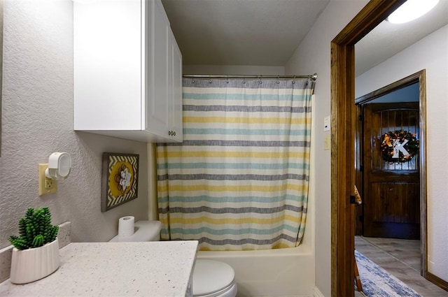 full bathroom with vanity, shower / bath combination with curtain, and toilet