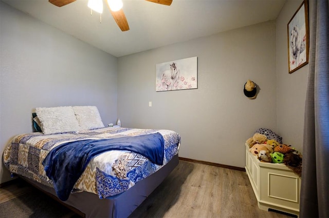 bedroom with ceiling fan and hardwood / wood-style floors