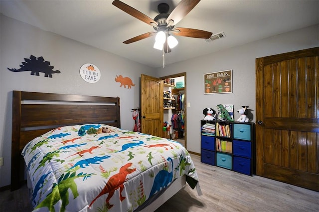 bedroom featuring ceiling fan and light wood-type flooring