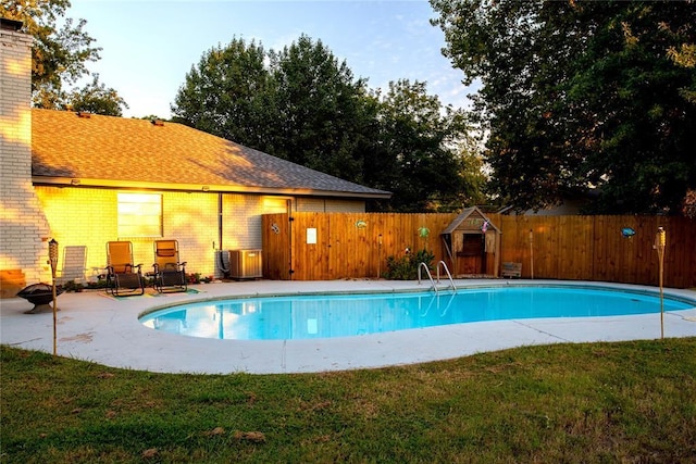 view of pool featuring a yard and a patio