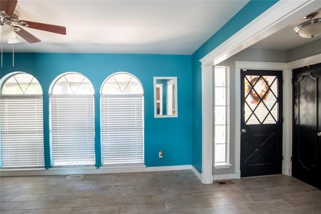 foyer featuring ceiling fan